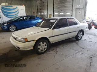 1991 Toyota Camry z VIN 4T1VV21E8MU050409, wystawiony jako Copart lot #61379824 z przebiegiem 100 949 mil mil oraz Nie do naprawy • Non repairable. Historia ofert i sprzedaży dostępna na DreamBid. Obrazek 1.