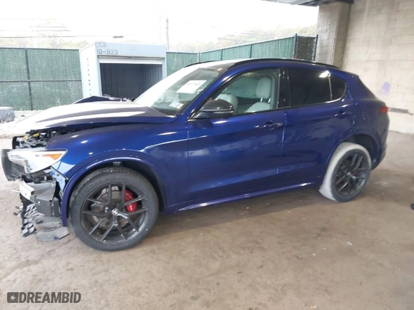 2021 Alfa Romeo Stelvio Ti with VIN ZASPAKBN4M7D21284, listed as a IAAI auction lot 40573443 with 26,230 mi miles. Bid and sale history available at carsss.com. Image 2.
