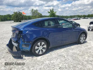 2022 Tesla Model Y Long Range z VIN 7SAYGDEE4NF426893, wystawiony jako Copart lot #55809275 z przebiegiem 16 083 mil mil oraz Szkoda całkowita • Salvage title. Historia ofert i sprzedaży dostępna na DreamBid. Obrazek 3.