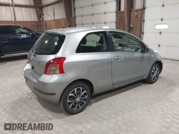 2008 Toyota Yaris with VIN JTDJT923085171725, listed as a IAAI auction lot 42090252 with 242,092 mi miles. Bid and sale history available at carsss.com. Image 4.