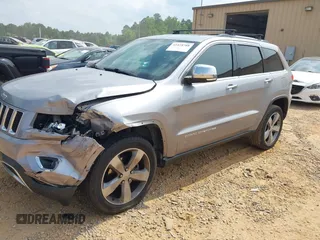 2014 Jeep Grand Cherokee Limited with VIN 1C4RJFBG9EC210507, listed as a IAAI auction lot 42428788 with 141,147 mi miles and . Bid and sale history available at DreamBid. Image 2.