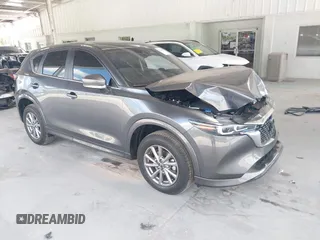 2024 Mazda CX-5 S Carbon Edition z VIN JM3KFBCL2R0426088, wystawiony jako IAAI lot #42136408 z przebiegiem 7769 mil mil oraz . Historia ofert i sprzedaży dostępna na DreamBid. Obrazek 1.