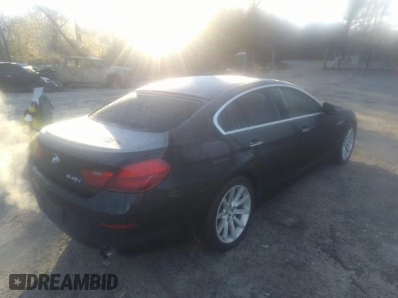 2014 BMW 6 Series 640i z VIN WBA6A0C55EDZ04549, wystawiony jako IAAI lot #41764155 z przebiegiem 154 705 mil mil oraz . Historia ofert i sprzedaży dostępna na DreamBid. Obrazek 4.