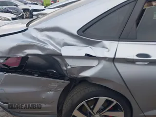 2019 Volkswagen Jetta GLI S z VIN 3VW5T7BU4KM165083, wystawiony jako IAAI lot #40729763 z przebiegiem 75 414 mil mil oraz . Historia ofert i sprzedaży dostępna na DreamBid. Obrazek 6.