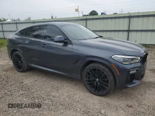 2021 BMW X6 M50i z VIN 5UXCY8C04M9D98591, wystawiony jako Copart lot #60606155 z przebiegiem 90 639 mil mil oraz Czysty tytuł • Clean title. Historia ofert i sprzedaży dostępna na DreamBid. Obrazek 4.