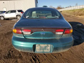 1997 Ford Taurus G with VIN 1FALP51U4VG297298, listed as a Copart auction lot 79660284 with 115,038 mi miles and Clean Title. Bid and sale history available at carsss.com. Image 6.