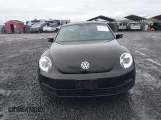 2014 Volkswagen Beetle 2.5L w/Sun with VIN 3VWJP7AT3EM608906, listed as a IAAI auction lot 41501830 with 42,804 mi miles and . Bid and sale history available at DreamBid. Image 12.