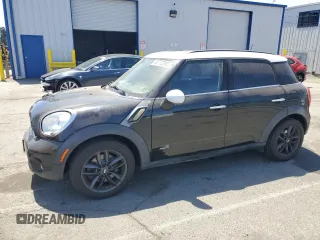 2013 MINI Countryman S ALL4 with VIN WMWZC5C52DWP30625, listed as a Copart auction lot 62772395 with 129,498 mi miles and Salvage title. Bid and sale history available at DreamBid. Image 1.