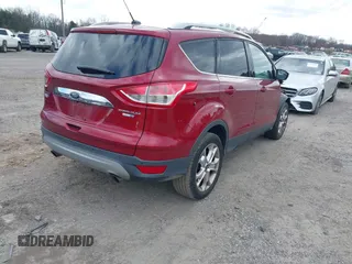 2016 Ford Escape Titanium with VIN 1FMCU9JX2GUA89716, listed as a IAAI auction lot 41899786 with 85,474 mi miles and . Bid and sale history available at DreamBid. Image 4.