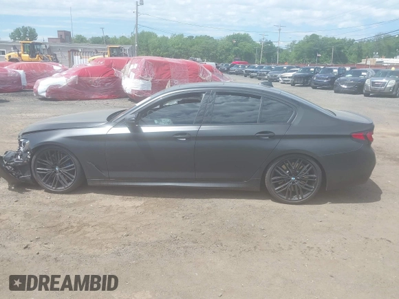 2023 BMW 5 Series M550i xDrive with VIN WBA13BK02PCN47443, listed as a IAAI auction lot 42290388 with Not provided miles and . Bid and sale history available at DreamBid. Image 14.