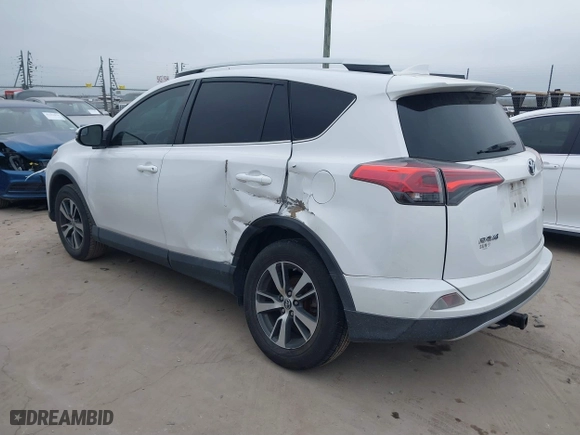 2016 Toyota RAV4 XLE with VIN 2T3WFREV8GW259777, listed as a IAAI auction lot 41241266 with 129,122 mi miles. Bid and sale history available at carsss.com. Image 3.