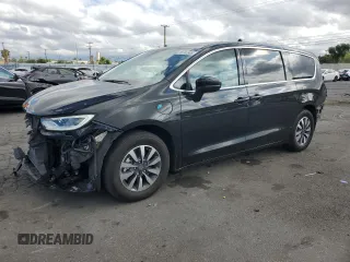 2023 Chrysler Pacifica Hybrid Touring L with VIN 2C4RC1L70PR632560, listed as a Copart auction lot 56592885 with 38,276 mi miles and Salvage title. Bid and sale history available at DreamBid. Image 1.