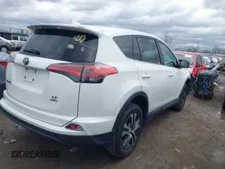 2018 Toyota RAV4 LE with VIN 2T3BFREVXJW793174, listed as a IAAI auction lot 42037936 with 82,304 mi miles. Bid and sale history available at carsss.com. Image 4.