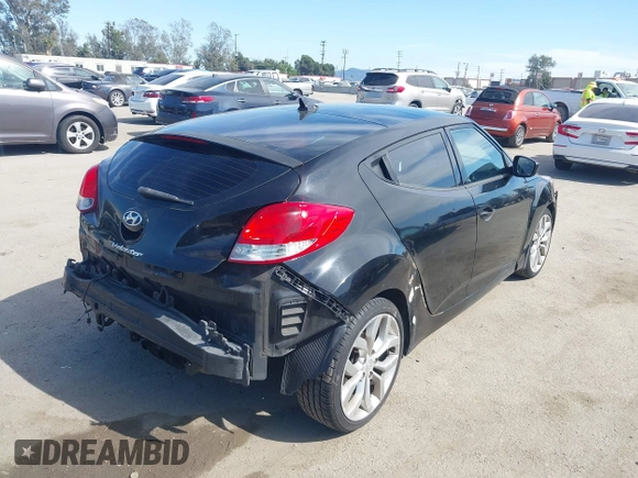 2013 Hyundai Veloster w/Black Int with VIN KMHTC6AD4DU132701, listed as a IAAI auction lot 42021759 with 102,840 mi miles and . Bid and sale history available at DreamBid. Image 4.