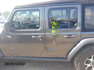 2021 Jeep Wrangler Unlimited Rubicon with VIN 1C4HJXFN5MW509483, listed as a IAAI auction lot 42245703 with 59,461 mi miles and . Bid and sale history available at DreamBid. Image 14.