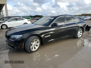 2011 BMW 7 Series 740i with VIN WBAKA4C59BC392351, listed as a Copart auction lot 84942304 with 76,874 mi miles and Salvage Title. Bid and sale history available at carsss.com. Image 1.