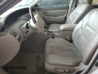 2003 Toyota Avalon XL z VIN 4T1BF28B03U280486, wystawiony jako Copart lot #57152935 z przebiegiem 131 996 mil mil oraz Szkoda całkowita • Salvage title. Historia ofert i sprzedaży dostępna na DreamBid. Obrazek 7.