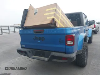 2023 Jeep Gladiator Sport S z VIN 1C6HJTAG6PL579136, wystawiony jako IAAI lot #41946641 z przebiegiem 14 856 mil mil oraz . Historia ofert i sprzedaży dostępna na DreamBid. Obrazek 16.