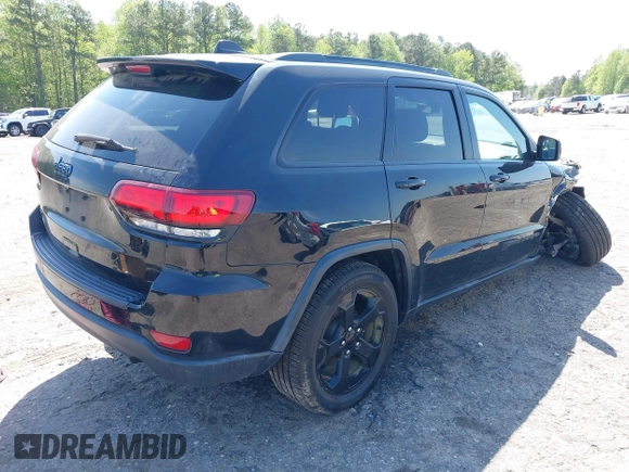 2019 Jeep Grand Cherokee Altitude with VIN 1C4RJFAG8KC808309, listed as a IAAI auction lot 41977457 with 122,923 mi miles and . Bid and sale history available at DreamBid. Image 4.