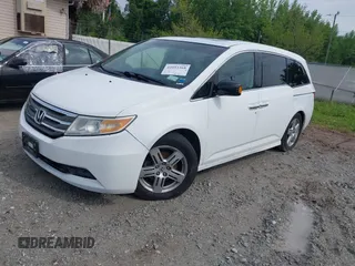 2011 Honda Odyssey Touring with VIN 5FNRL5H90BB066177, listed as a IAAI auction lot 42053368 with 239,205 mi miles and . Bid and sale history available at DreamBid. Image 17.