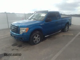 2009 Ford F-150 STX with VIN 1FTRX14849FA11909, listed as a IAAI auction lot 40979039 with 162,013 mi miles. Bid and sale history available at carsss.com. Image 2.