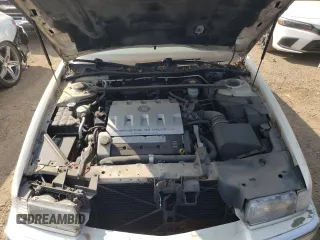 2000 Cadillac Eldorado z VIN 1G6EL12Y2YU179560, wystawiony jako Copart lot #70635784 z przebiegiem 92 959 mil mil oraz Tytuł czysty. Historia ofert i sprzedaży dostępna na DreamBid. Obrazek 11.