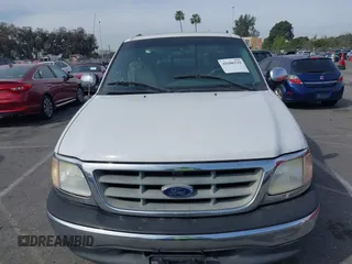 2001 Ford F-150 XL with VIN 1FTRX07L91KA77460, listed as a IAAI auction lot 41686519 with 185,286 mi miles. Bid and sale history available at carsss.com. Image 6.