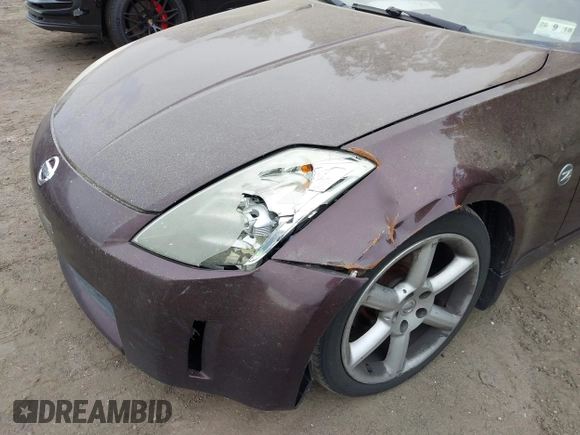 2003 Nissan 350Z Touring z VIN JN1AZ34E93T008895, wystawiony jako IAAI lot #42345352 z przebiegiem 168 530 mil mil oraz . Historia ofert i sprzedaży dostępna na DreamBid. Obrazek 6.