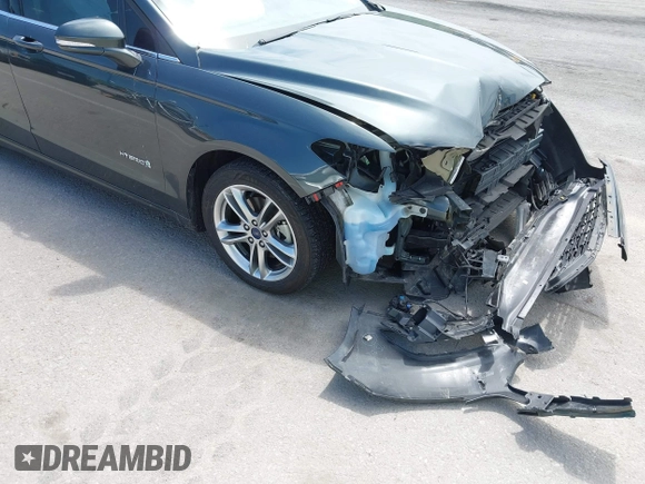 2015 Ford Fusion SE Hybrid with VIN 3FA6P0LU7FR224823, listed as a IAAI auction lot 42199479 with 81,835 mi miles and . Bid and sale history available at DreamBid. Image 13.