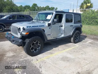 2023 Jeep Wrangler Rubicon with VIN 1C4JJXR63PW703424, listed as a IAAI auction lot 42639653 with 46,412 mi miles and . Bid and sale history available at DreamBid. Image 16.