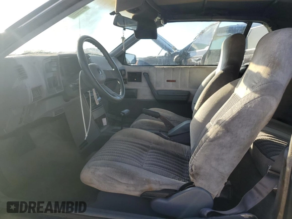 1989 Chevrolet Cavalier with VIN 1G1JF31W1K7190840, listed as a Copart auction lot 77747934 with Not Provided miles and Salvage Title. Bid and sale history available at DreamBid. Image 7.