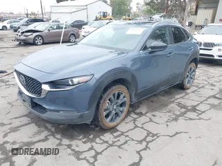 2022 Mazda CX-30 S Carbon Edition with VIN 3MVDMBCL0NM456154, listed as a IAAI auction lot 42153202 with 40,372 mi miles and . Bid and sale history available at DreamBid. Image 2.