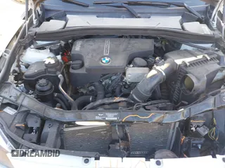 2015 BMW X1 xDrive28i z VIN WBAVL1C57FVY25598, wystawiony jako IAAI lot #41860463 z przebiegiem Nie podano mil oraz . Historia ofert i sprzedaży dostępna na DreamBid. Obrazek 10.