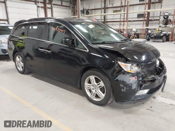2011 Honda Odyssey Touring with VIN 5FNRL5H9XBB055008, listed as a IAAI auction lot 41973447 with 218,762 mi miles and . Bid and sale history available at DreamBid. Image 1.