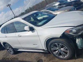 2017 BMW X1 xDrive28i with VIN WBXHT3Z30H4A64932, listed as a IAAI auction lot 41779359 with 72,612 mi miles. Bid and sale history available at carsss.com. Image 14.