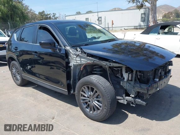 2019 Mazda CX-5 Sport with VIN JM3KFABM7K1509987, listed as a IAAI auction lot 42062804 with 50,898 mi miles and . Bid and sale history available at DreamBid. Image 1.