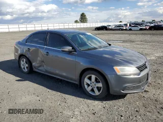 2014 Volkswagen Jetta TDI w/Premium with VIN 3VW3L7AJ4EM273755, listed as a Copart auction lot 52389795 with 184,586 mi miles and Salvage title. Bid and sale history available at DreamBid. Image 4.