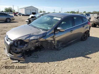 2014 Ford Focus Titanium with VIN 1FADP3N20EL264209, listed as a Copart auction lot 57862025 with 103,972 mi miles and Salvage title. Bid and sale history available at DreamBid. Image 1.