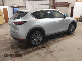 2021 Mazda CX-5 Grand Touring with VIN JM3KFADMXM1318015, listed as a IAAI auction lot 41221528 with 79,473 mi miles. Bid and sale history available at carsss.com. Image 4.