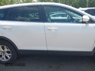 2014 Mazda CX-9 Touring z VIN JM3TB3CV7E0426900, wystawiony jako IAAI lot #42796725 z przebiegiem Nie podano mil oraz . Historia ofert i sprzedaży dostępna na DreamBid. Obrazek 13.
