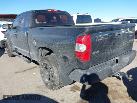 2014 Toyota Tundra 4WD Truck SR with VIN 5TFUM5F17EX051674, listed as a IAAI auction lot 41296906 with 140,782 mi miles. Bid and sale history available at carsss.com. Image 3.