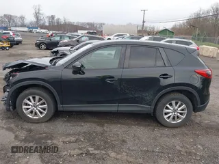 2016 Mazda CX-5 Touring with VIN JM3KE4CY4G0738713, listed as a IAAI auction lot 41998597 with 146,595 mi miles and . Bid and sale history available at carsss.com. Image 14.