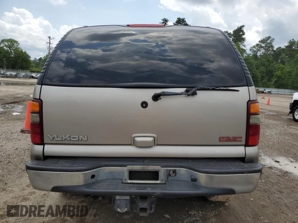 2002 GMC Yukon SLT z VIN 1GKEC13Z22R158811, wystawiony jako Copart lot #74568464 z przebiegiem Nie podano mil oraz Szkoda całkowita • Salvage title. Historia ofert i sprzedaży dostępna na DreamBid. Obrazek 6.