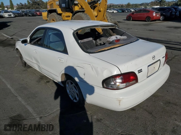 1999 Mazda 626 LX z VIN 1YVGF22D4X5882600, wystawiony jako Copart lot #69031604 z przebiegiem Nie podano mil oraz Szkoda całkowita • Salvage title. Historia ofert i sprzedaży dostępna na DreamBid. Obrazek 2.