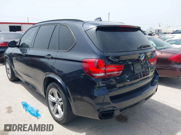 2014 BMW X5 xDrive50i with VIN 5UXKR6C55E0C03743, listed as a IAAI auction lot 42268302 with 118,892 mi miles and . Bid and sale history available at DreamBid. Image 3.