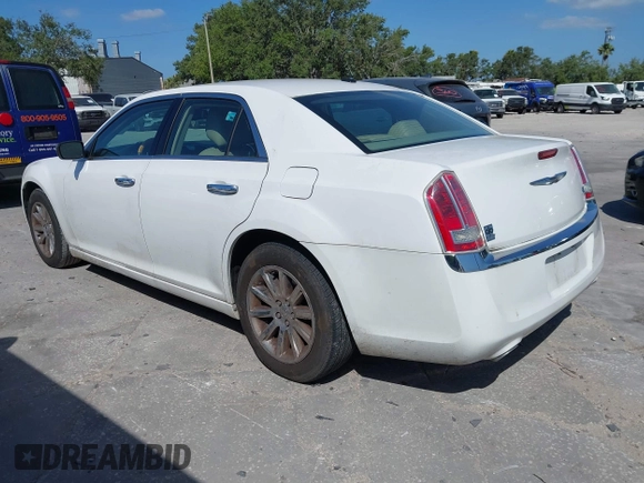 2014 Chrysler 300 with VIN 2C3CCAET6EH173381, listed as a IAAI auction lot 42158270 with 124,551 mi miles. Bid and sale history available at carsss.com. Image 3.