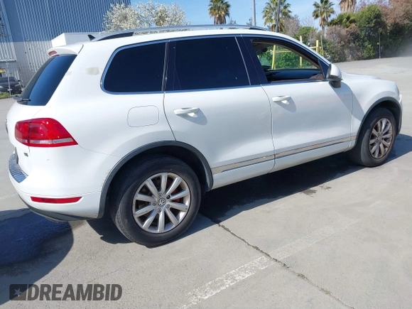 2012 Volkswagen Touareg Sport with VIN WVGEF9BP5CD007294, listed as a IAAI auction lot 41841268 with 160,883 mi miles and . Bid and sale history available at DreamBid. Image 4.