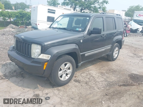 2011 Jeep Liberty Sport Jet z VIN 1J4PN2GK9BW592303, wystawiony jako IAAI lot #42475552 z przebiegiem 241 856 mil mil oraz . Historia ofert i sprzedaży dostępna na DreamBid. Obrazek 2.