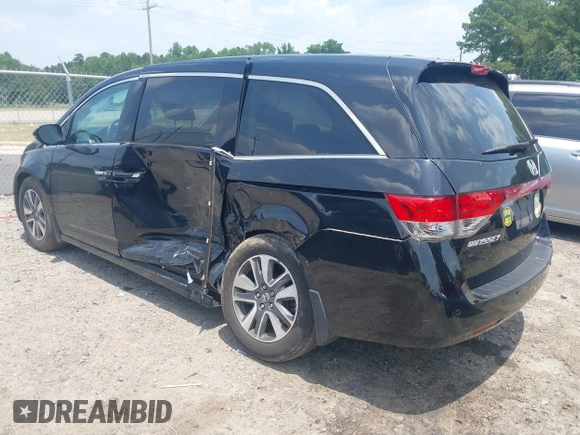 2015 Honda Odyssey Touring Elite with VIN 5FNRL5H90FB003506, listed as a IAAI auction lot 42585049 with 120,543 mi miles and . Bid and sale history available at DreamBid. Image 3.