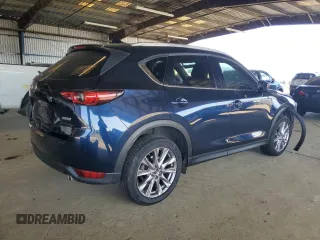 2019 Mazda CX-5 Grand Touring with VIN JM3KFADM3K1539890, listed as a Copart auction lot 57809835 with 56,079 mi miles and Salvage title. Bid and sale history available at DreamBid. Image 3.